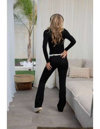 Pantalón campana Wolf Camaleónica by Capriche negro con cinturilla blanca - vista frontal 2